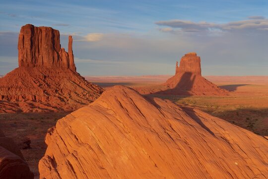 Monument Valley with majestic red sandstone formations in the desert under a clear sky in sunlight, Monument Valley Navajo Tribal Park, Utah-Arizona, USA