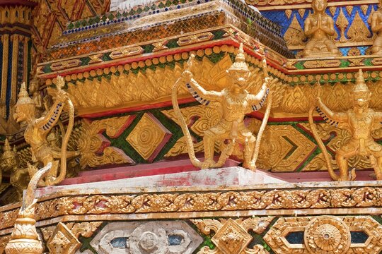 Gilded gold-colored statues figures of Buddhist temple guards mystical guards at Buddhist temple Wat Bang Riang, Thap Put, Amphoe Hap Put, Phang Nga Province, Thailand