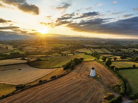 Sunset of Fields and Farms over Devon from a drone, Torquay, Torbay, Devon, England, United Kingdom