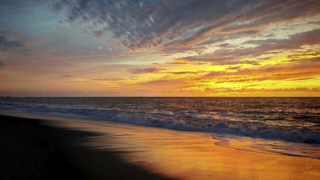 Romantic sunset over the sea with warm colors and calm water, Tarrafal de Monte Trigo, Santo Antao, Cabo Verde, Cape Verde, Cape Verde