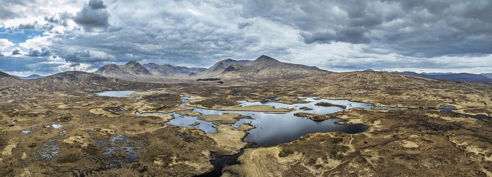 Panorama of Rannoch Moor from a drone over Loch Ba and Loch of the Armpit, A82 Highland Way, Argyll and Bute, West Highlands, Scotland, United Kingdom