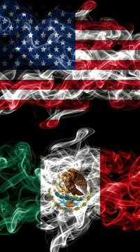 United states and mexico flags formed by swirling smoke trails on a black background