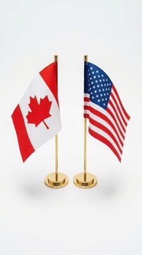 Small canadian and american flags on gold stands, isolated against a plain white background