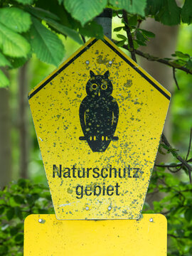 Sign at the entrance of german nature reserve depicting an owl