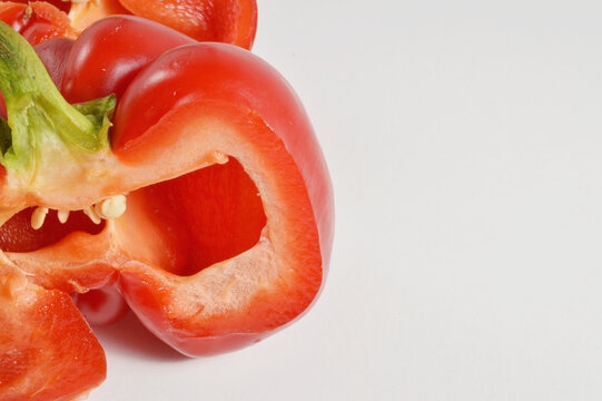 chopped red bell pepper against clean white background with generous copy space, red pepper culinary overlay, pepper photo for branding