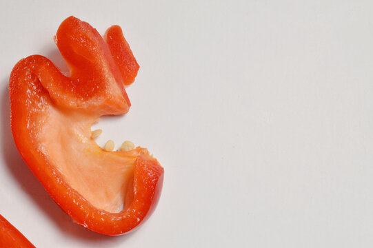 chopped red bell pepper against clean white background with generous copy space, red pepper culinary overlay, pepper photo for branding