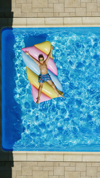 Child in swimming pool. Having fun on vacation at the hotel pool. Colorful vacation concept.