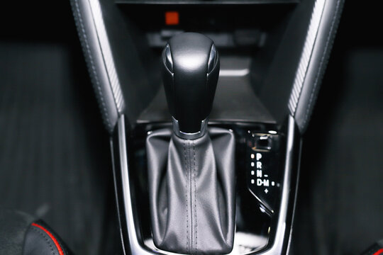 Automatic transmission gear with leather of luxury car on glossy black console interior detail. concept transport travel.	
