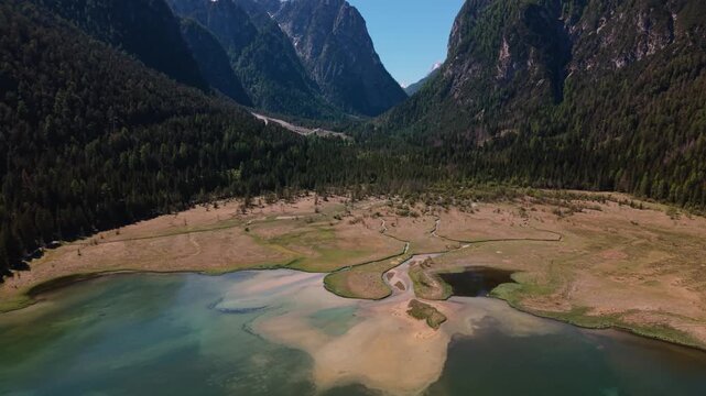 Toblachsee Lago di Dobbiaco inflows and wetlands at the edge of the alpine lake. Beautiful aerial view