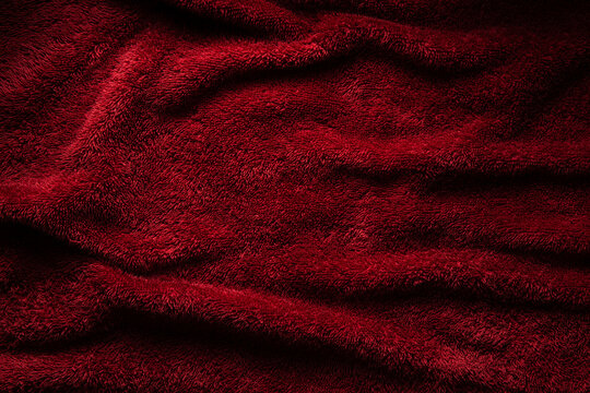 Elegant crimson plush fabric background folds