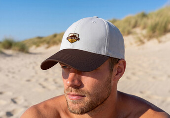 Man at the Beach Wearing a Cap with Logo Mockup