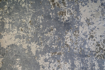 Fototapeta premium Weathered concrete wall texture with distressed grey finish and peeling surface details. Ideal for industrial backgrounds, architectural visualization, wall materials, and seamless texture design.