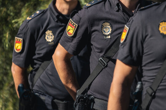 Spanish National Police officers standing in uniform, showing the emblem UPR on their sleeves and badge on their chest in Salamanca, Spain, on 16-06-2026