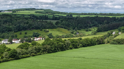 Naklejka premium Rolling Scottish green hillsides forming rural countryside landscape