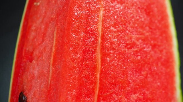 Fresh watermelon slice captured in close detail, emphasizing juicy fruit flesh, natural freshness, and bright colors ideal for food photography and nutritious lifestyle themes. 4k.
