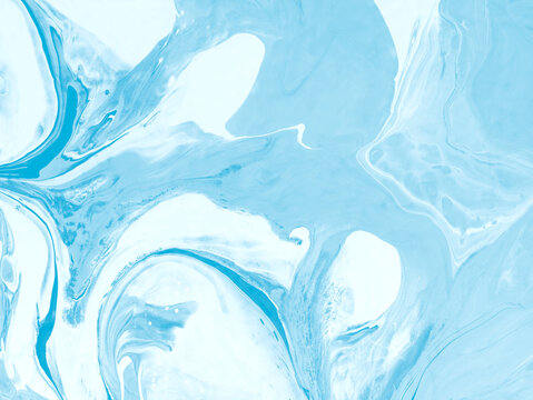 Abstract blue background of ocean waves, sea foam, sea landscapes,  fluid acrylic paint in shades of blue and white.