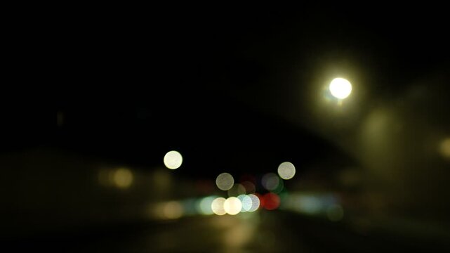 Blurry video from a running car in a tunnel seen by a person under the influence of alcohol.