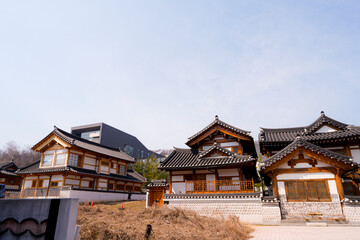 Fototapeta premium Traditional Korean hanok village houses with wooden architecture and tiled roofs