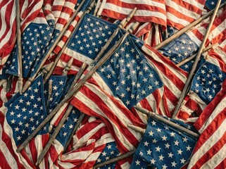 Fototapeta premium Pile of worn american flags with wooden poles