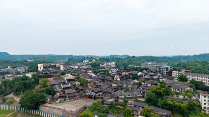 Fototapeta premium Aerial View of Traditional Town Surrounded by Green Hills