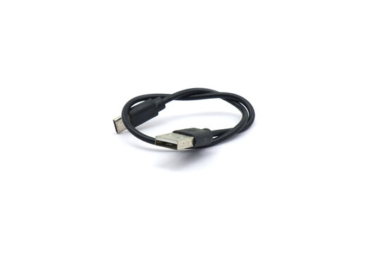 A black USB cable on a white background. A USB cable for data transfer.