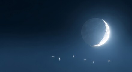 Obraz premium A crescent moon shines brightly in the deep blue night sky, with a constellation below