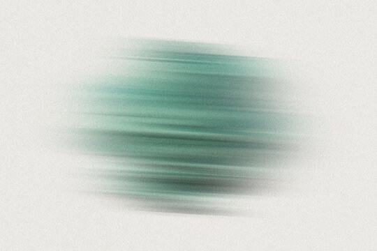 Green and white abstract shape with motion blur and grainy texture, isolated on light background.