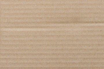 Fototapeta premium Brown Corrugated Cardboard Texture Background,Macro,A detailed close-up shot of a brown corrugated cardboard surface, featuring a textured pattern perfect for rustic, eco-friendly, or industrial.