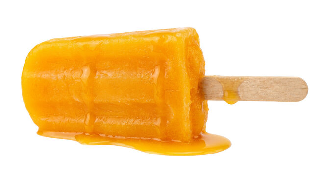 Refreshing orange popsicle melting on a wooden stick