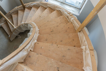 Fototapeta premium Spiral staircase under construction in new house