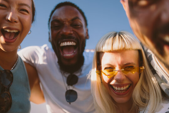 Diverse young people laughing and showing happiness together