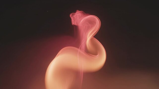 Ethereal orange vapor curling and dancing in the dark