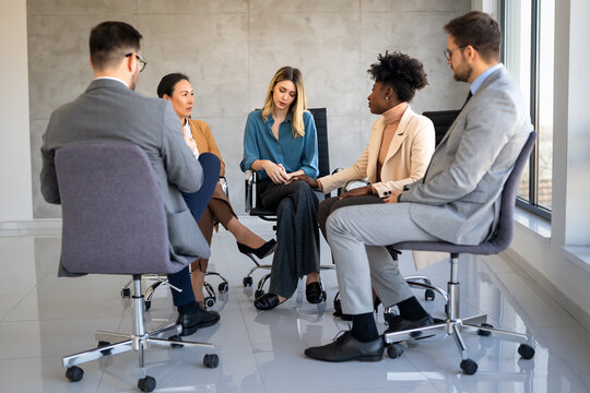 Counseling, psychology discussion with diverse people in therapy for depression, stress and anxiety