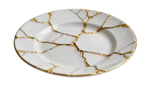White ceramic plate with gold kintsugi repair