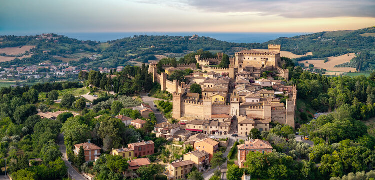 Gradara Medieval Borgo Aerial Drone View Marche Italy Charming Hilltop Village Green Rolling Hills and Adriatic Sea Background Historic Castle Fortress Architecture Scenic Landscape High Resolution 