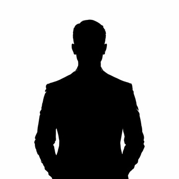 Businessman silhouette stands against a bright white background representing corporate leadership.