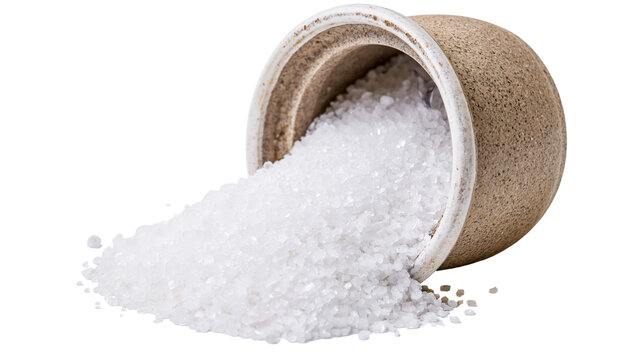 Coarse sea salt spilling from ceramic pot
