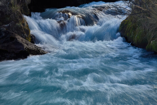 A milky glacial river tears through the heart of Quebrada Carhuascancha, a remote high-altitude valley tucked deep into the eastern flank of the Cordillera Blanca, far beyond the reach of day-trippers