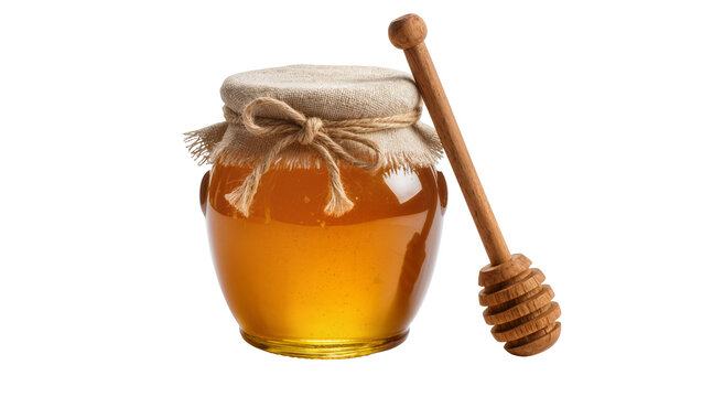 Glass jar filled with golden honey and wooden dipper
