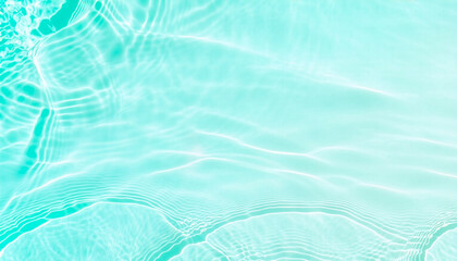Naklejka premium Bright turquoise water ripple surface texture with sunlight reflection 太陽光が反射するエメラルドグリーンの水面波紋テクスチャ背景
