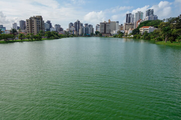 Obraz premium Violao lagoon and buildings cityscape in background. Torres city, RS, Brazil