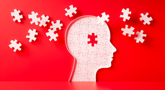 Conceptual artwork showing a 3D silhouette of a head surrounded by group of puzzle pieces, symbolizing mental input, activity, intelligence, or creativity - 3D illustration on red background	