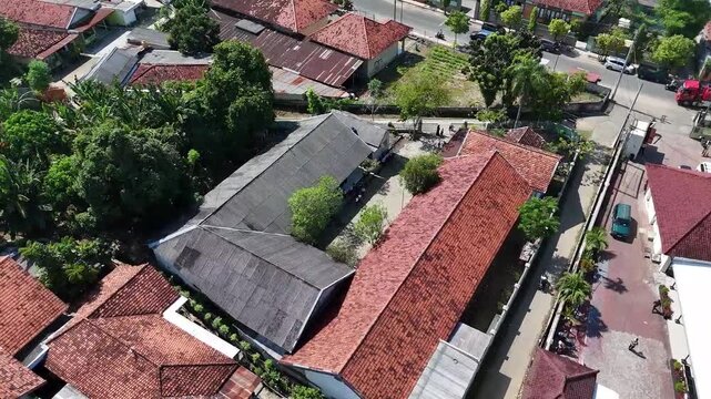 Aerial Drone Orbit Shot of Traditional Building Complex, School building and Main Road in Urban Residential Area