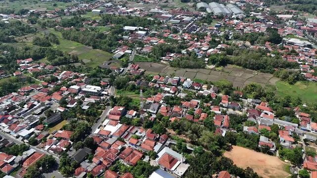 Aerial Drone Shot of Densely Populated Residential Area and Red Roof Village Houses in Indonesia