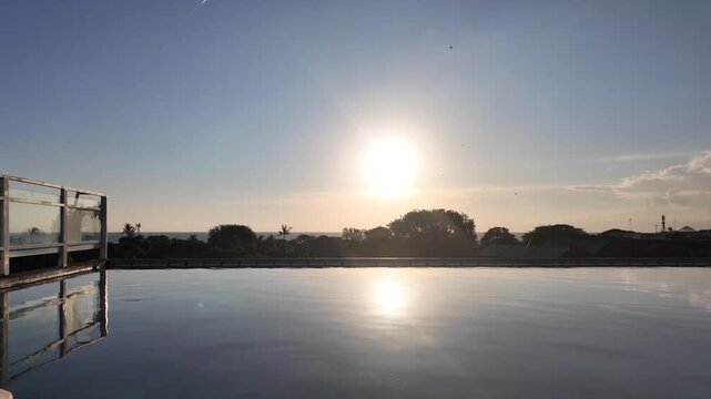 sunset at a rooftop pool in kuta on bali