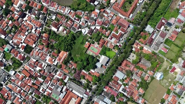 Top Down Aerial Drone View of Densely Populated Residential Houses and Small Sports Court