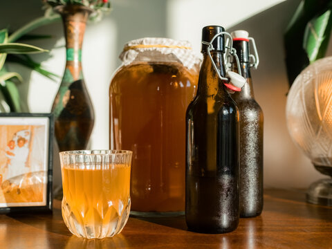 Freshly made kombucha on wooden table 