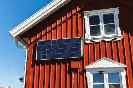 Solar Panel Installed on Red Scandinavian House