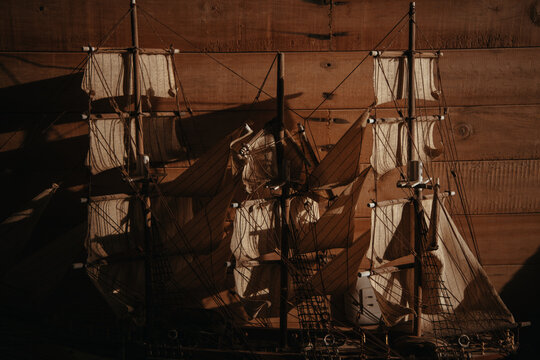 Wooden ships displayed on a dark wall in Colombia's coastal areas