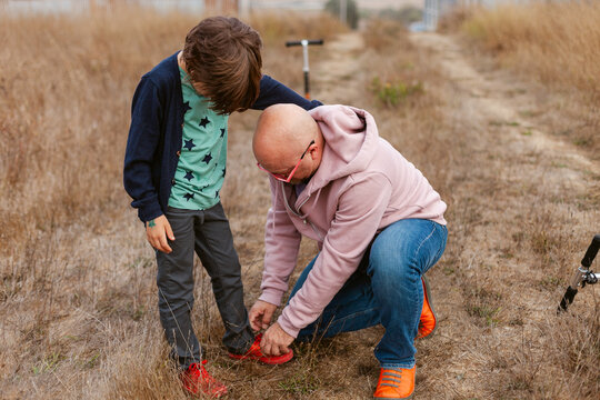 Helping Son Tie Shoelaces Playdate